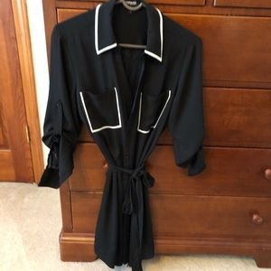 Black dress with white detailing and a tie
